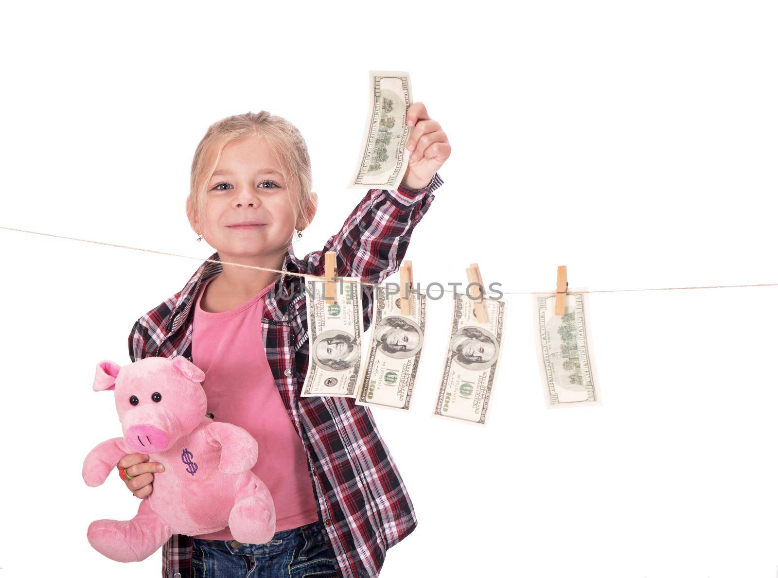 children and money. Girl hanging dollar bills on a rope isolated on white
