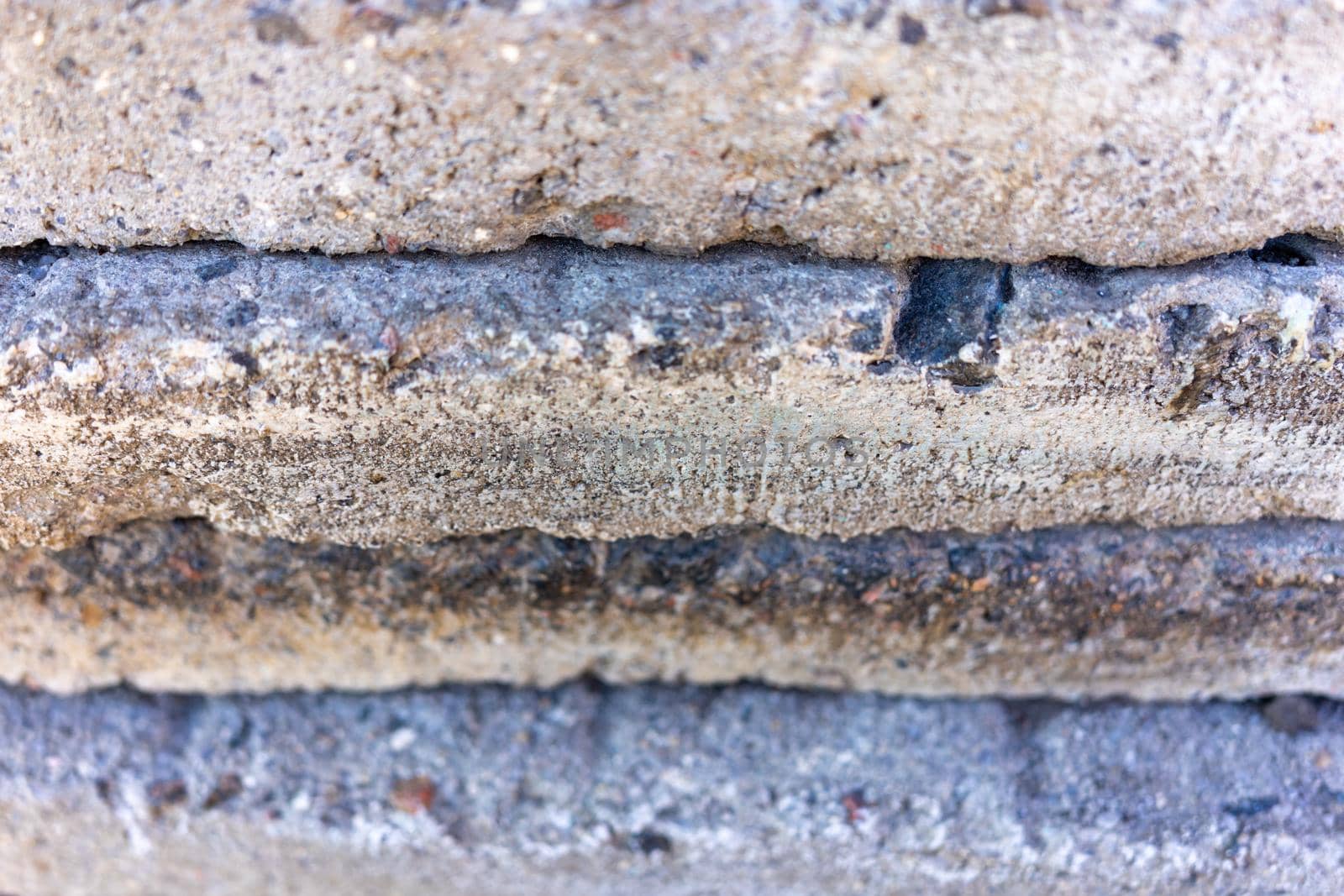 Texture of gray concrete with granite stones. gray abstract background. Close up. Natural stone texture.