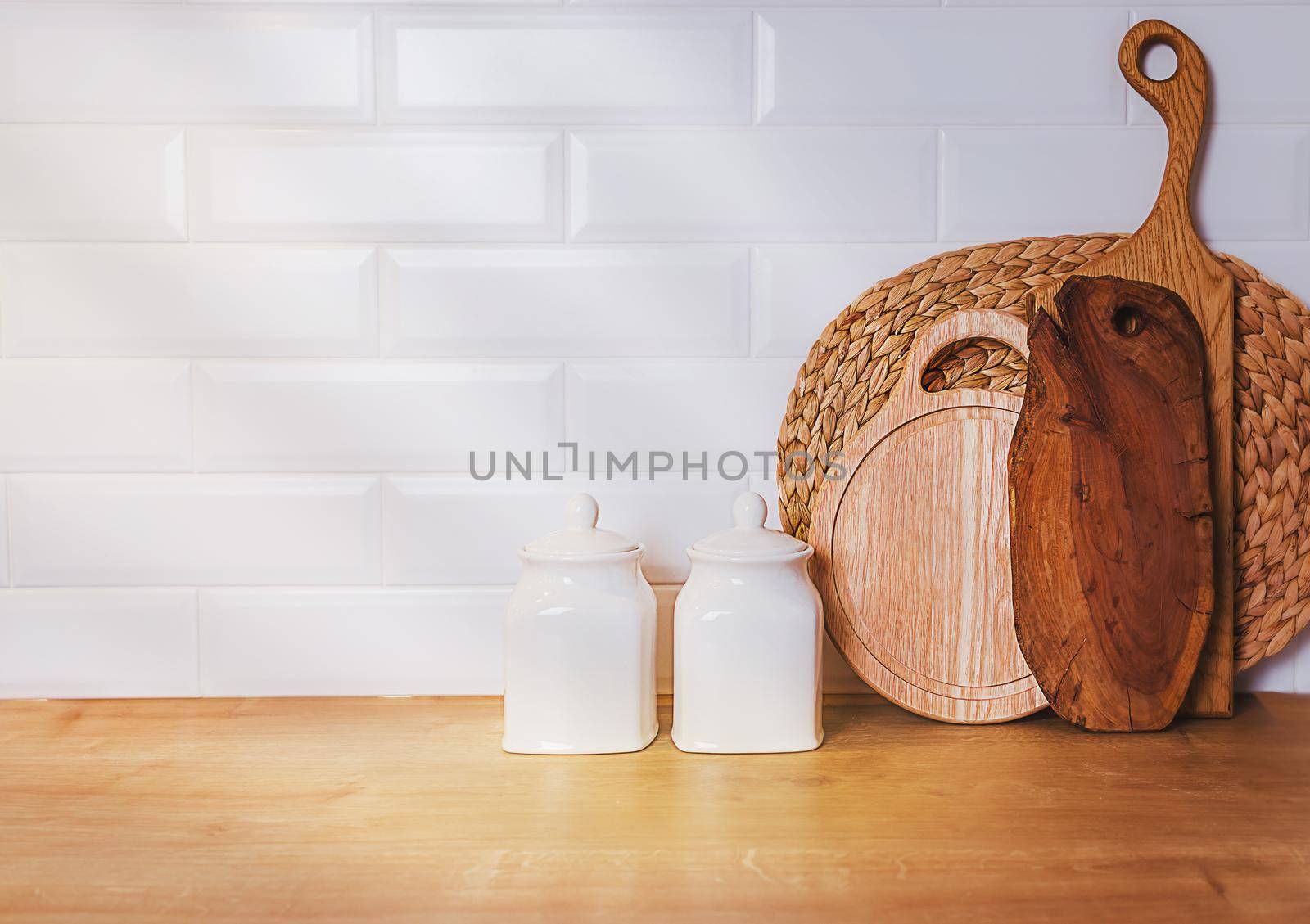 vintage kitchen template, mockup. Against white wall, kitchen utensils. Wooden cutting boards for vegetables and ceramic dishes. concept of home cooking recipes from natural products, copy your design