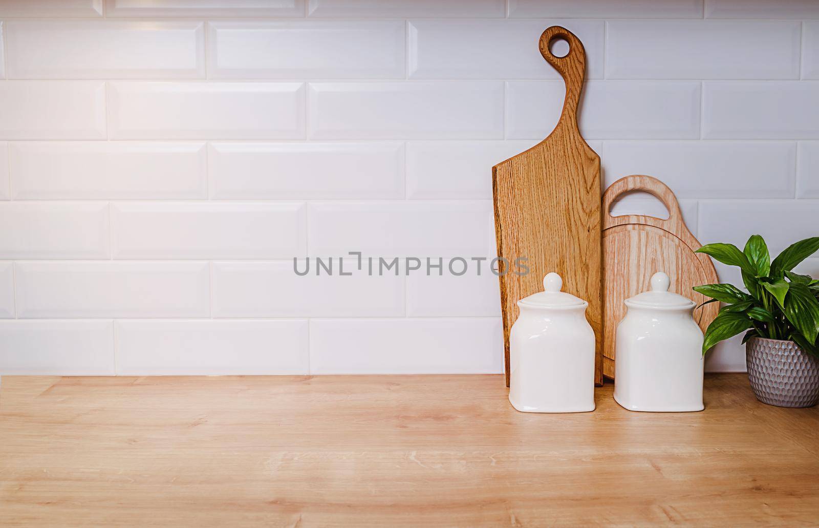 Template, vintage kitchen mockup with copy paste. Dishes, wooden boards and flowers culinary background. home cooking concept. Large empty piece of white wall, ceramic tile