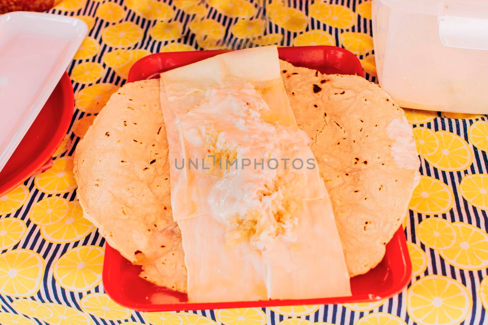 Traditional Nicaraguan Quesillo served on a plate on the table. Top view of Nicaraguan Quesillo served on table. Latin American food Quesillo, Traditional Quesillo with pickled onion by isaiphoto