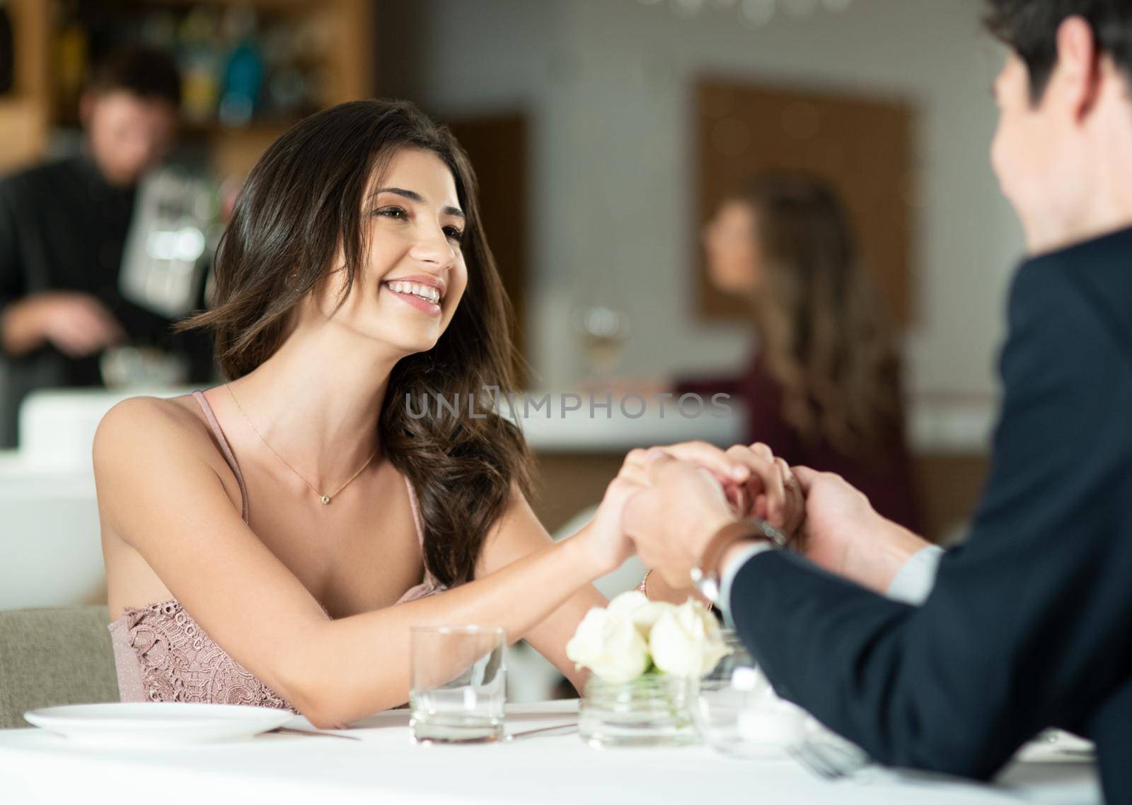 Look into their eyes, thats where love is. a happy young couple enjoying a romantic date at a restaurant