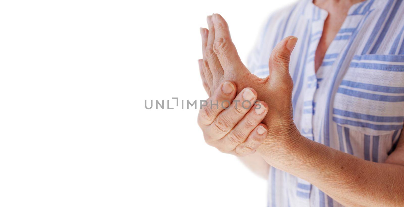 Elderly woman suffering from pain, numbness, weakness in arms. Causes of pain include osteoarthritis, rheumatoid arthritis, gout, peripheral neuropathy, lupus, Raynaud's phenomenon. White background