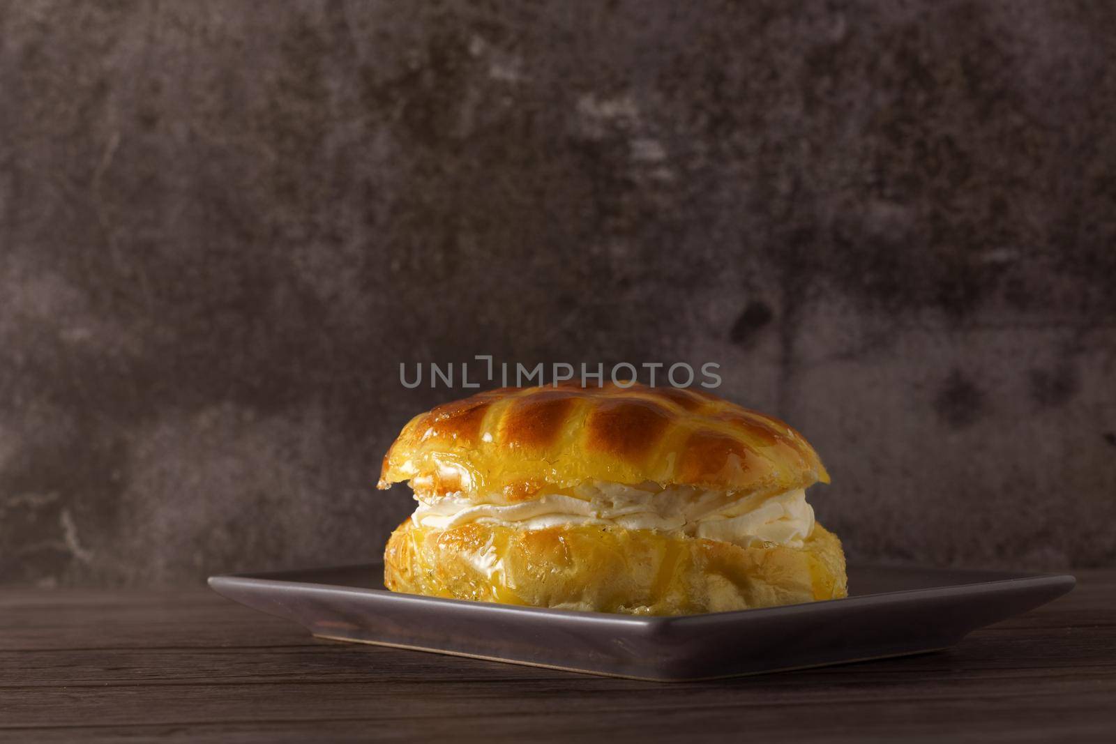 cream-filled bun covered with sugar syrup by joseantona