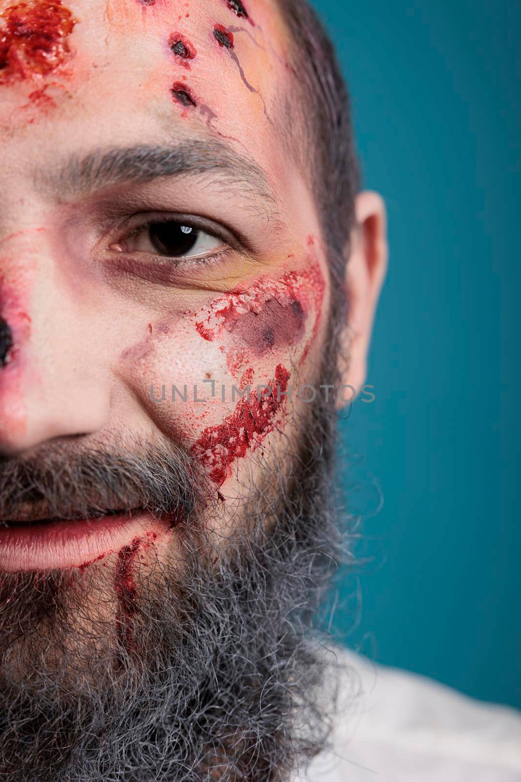 Halloween zombie having bloody wounds by DCStudio