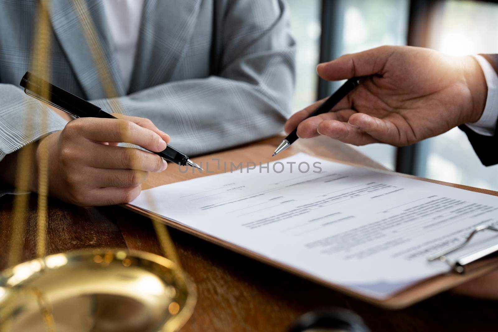 business people and lawyers discussing contract papers sitting at the table. Concepts of law, advice, legal services