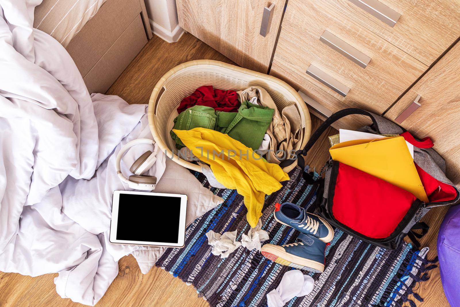 colored things are scattered on the floor in a big mess, top view. Teenage room by Ramanouskaya