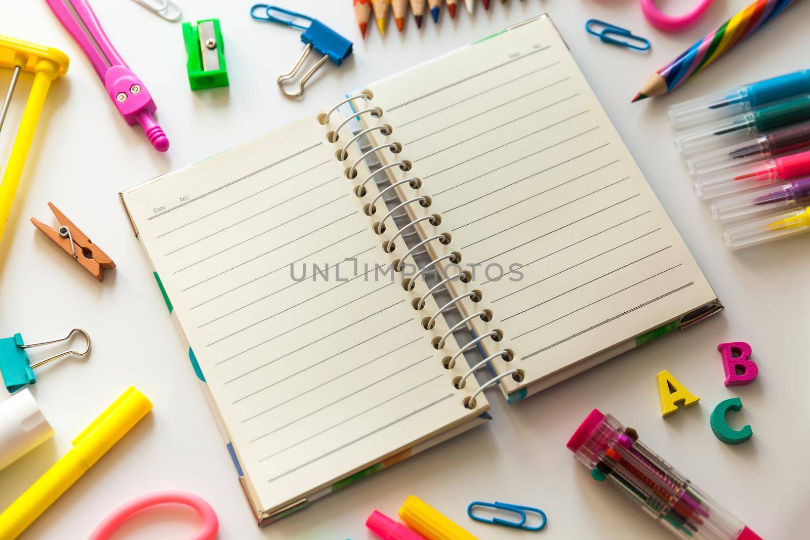 Blank notebook with School office supplies on a desk with copy space. Back to school concept.