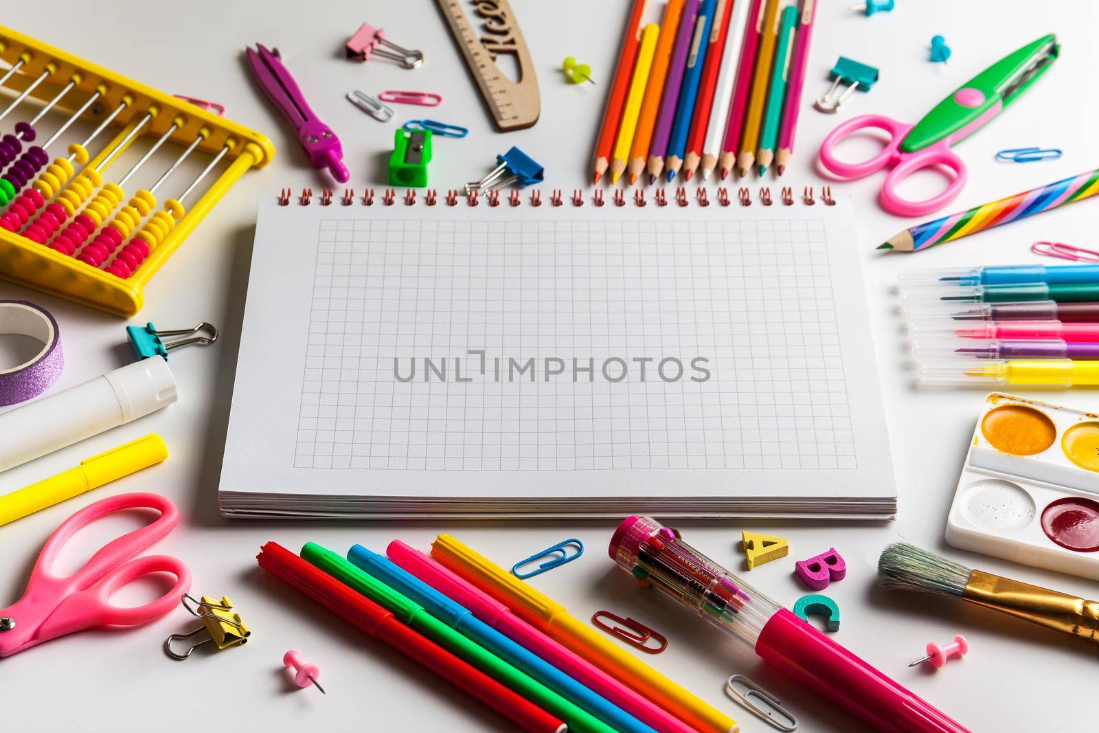 Blank notebook with School office supplies on a desk with copy space. Back to school concept.