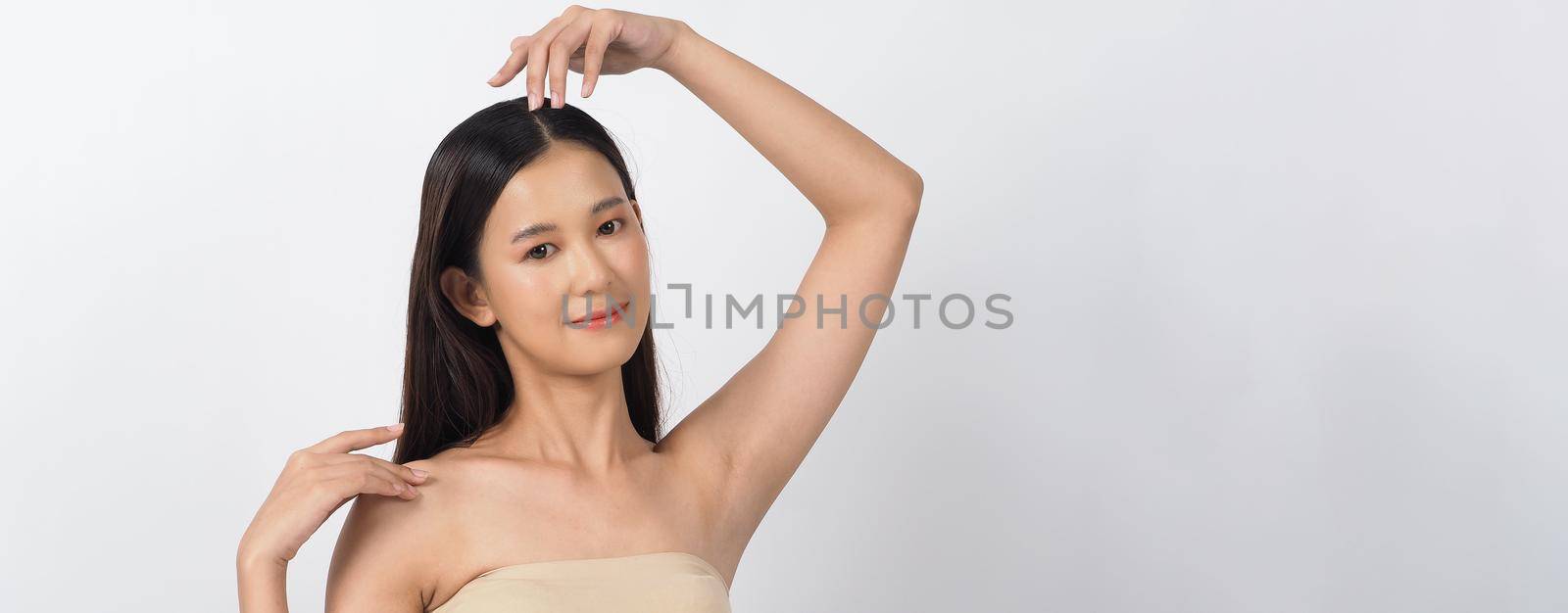 Beautiful young asian woman with clean fresh skin on white background. by gnepphoto