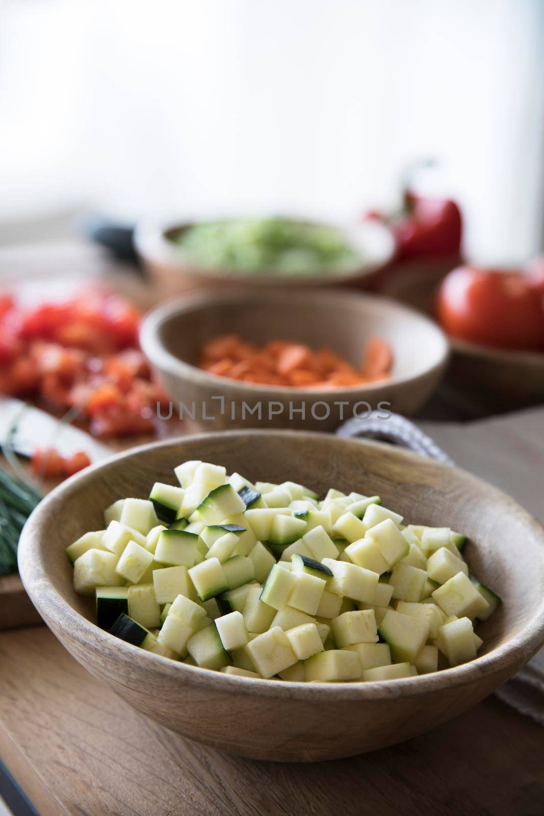 Zucchini Cubed in Wooden Bowl by charlotteLake