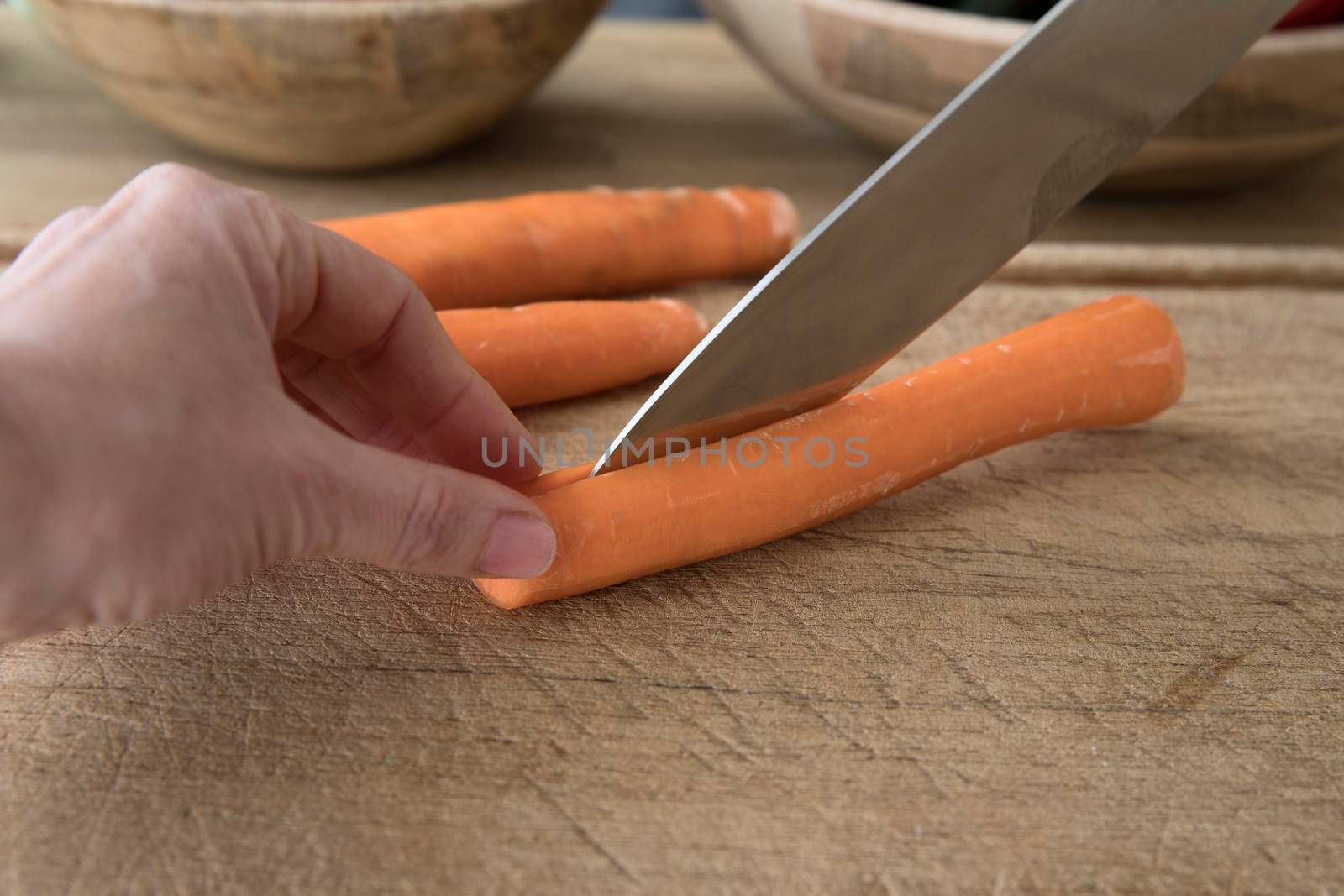 Slicing Carrot in Half by charlotteLake
