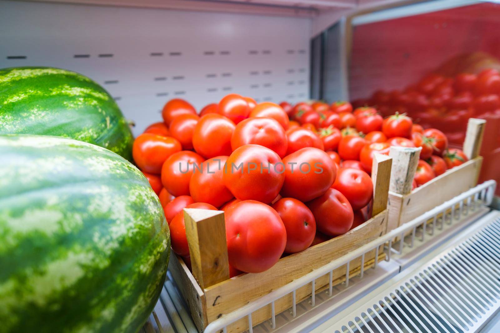 Healthy vegetables in grocery shop. Close up of fresh food in refrigerator.