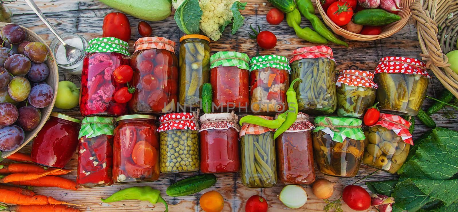 Jars with preserved vegetables for the winter. Selective focus. by yanadjana
