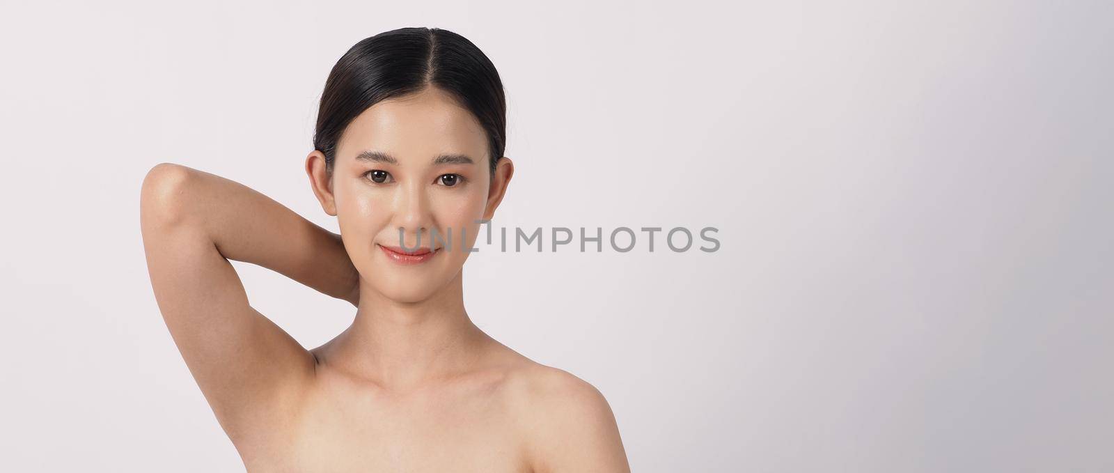 Beautiful young asian woman with clean fresh skin on white background. by gnepphoto