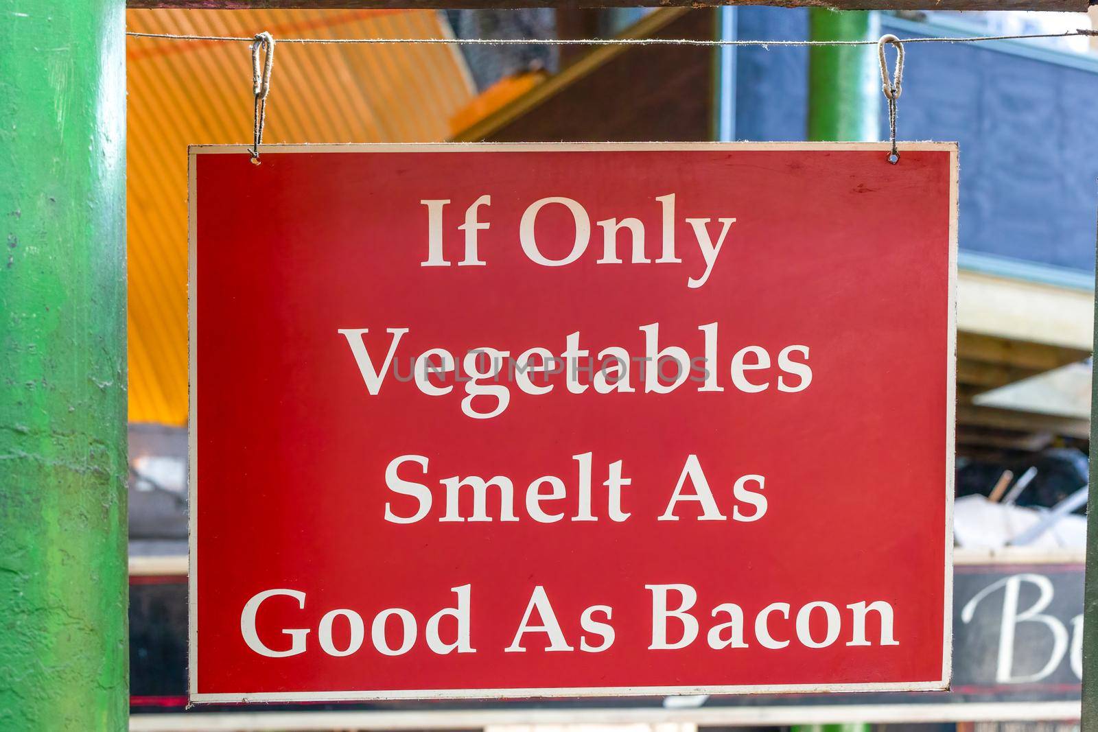 London, UK - November 19, 2020: If only vegetables smelt as good as bacon market sign by magicbones