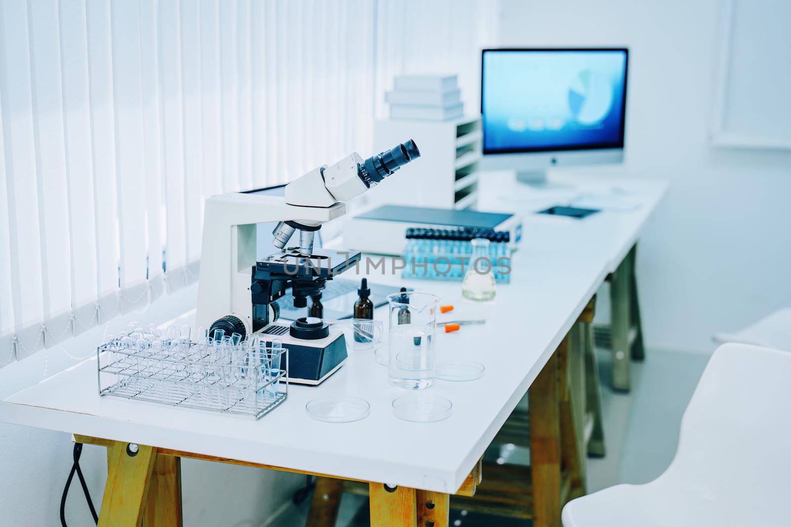 Medical Research Laboratory with Microscope and Test Tubes with Biochemicals on the Desk. Scientific Lab Biotechnology Development Center.