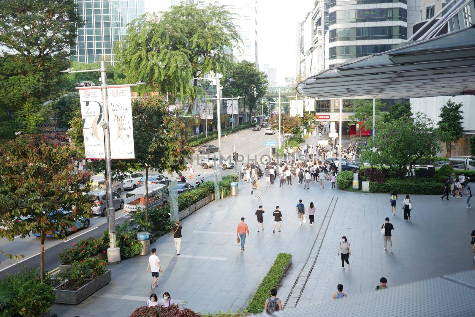 group of people walking together in Marina Bay
