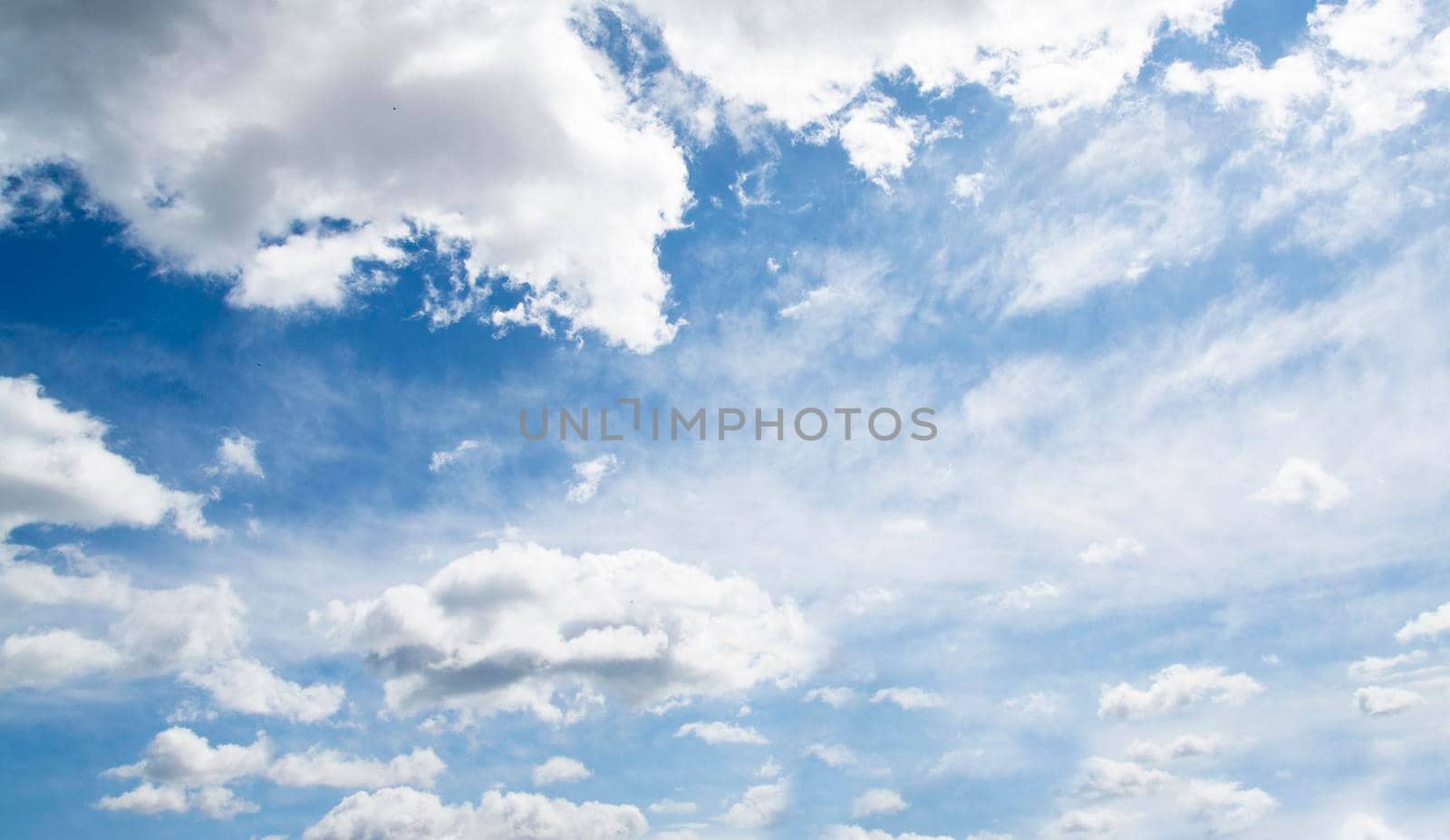White clouds on a background of blue sky by ssvimaliss