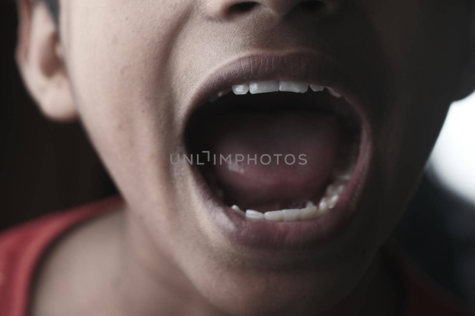 teenage boy screaming at camera ,