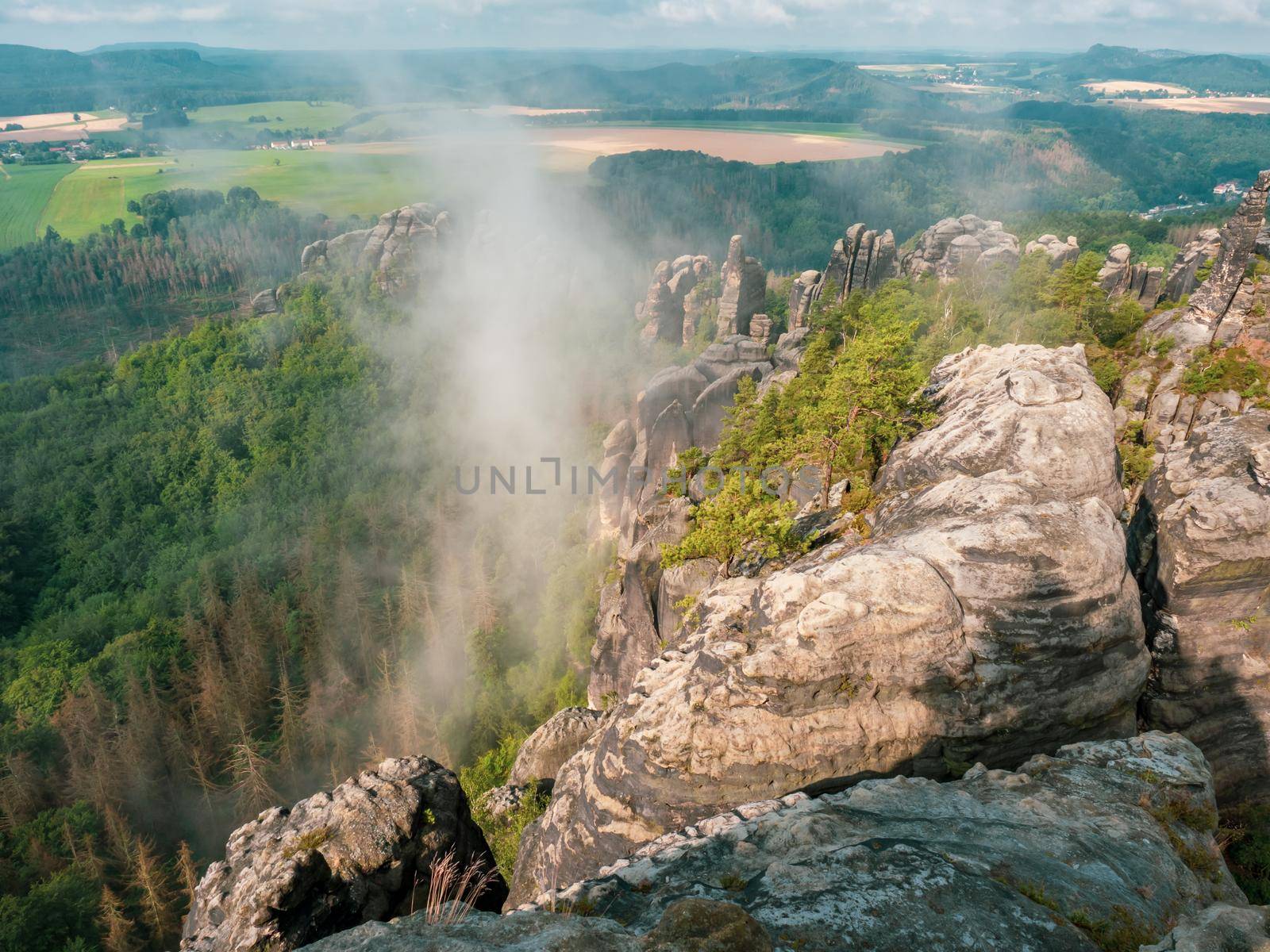 View of beautiful rocky park from the top of the Schrammsteine rocks vantage point above Bad Schandau, Saxony, Germany