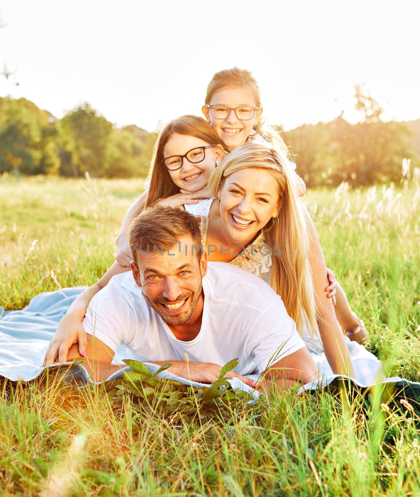 child family portrait outdoor mother woman father girl happy happiness lifestyle having fun bonding by Picsfive