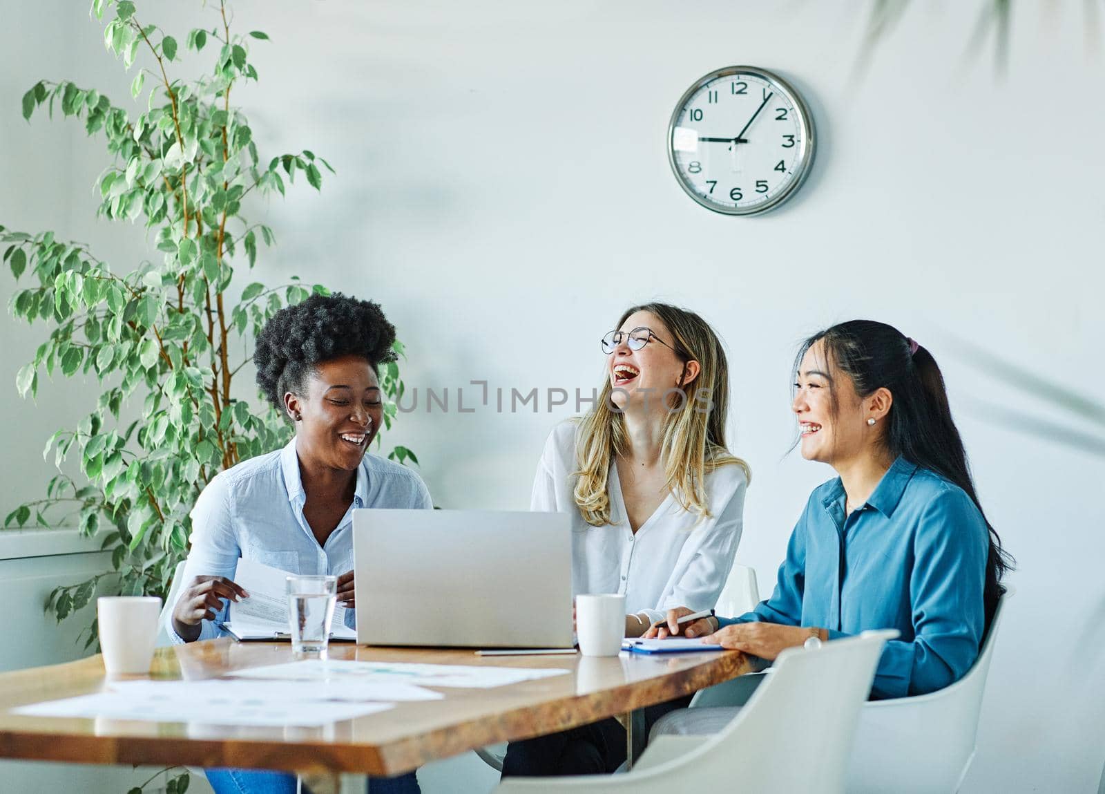 Portrait of a group of youn happy people in a start up office