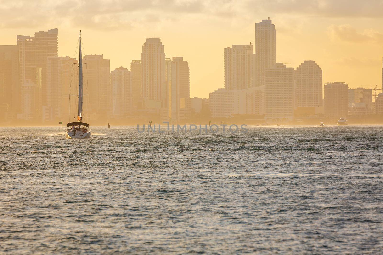 Miami sea habor at golden sunset with american flag, Florida, United States