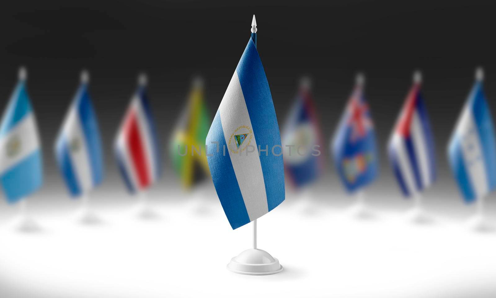 The national flag of the Nicaragua on the background of flags of other countries.