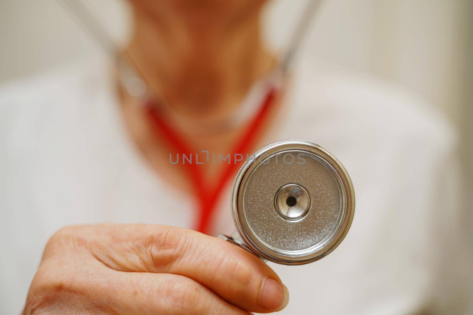 Medical background doctor stethoscope. Happy nurse in hospital uniform, hands with stethoscope isolated on white. Medical care and healthcare concept by Matiunina