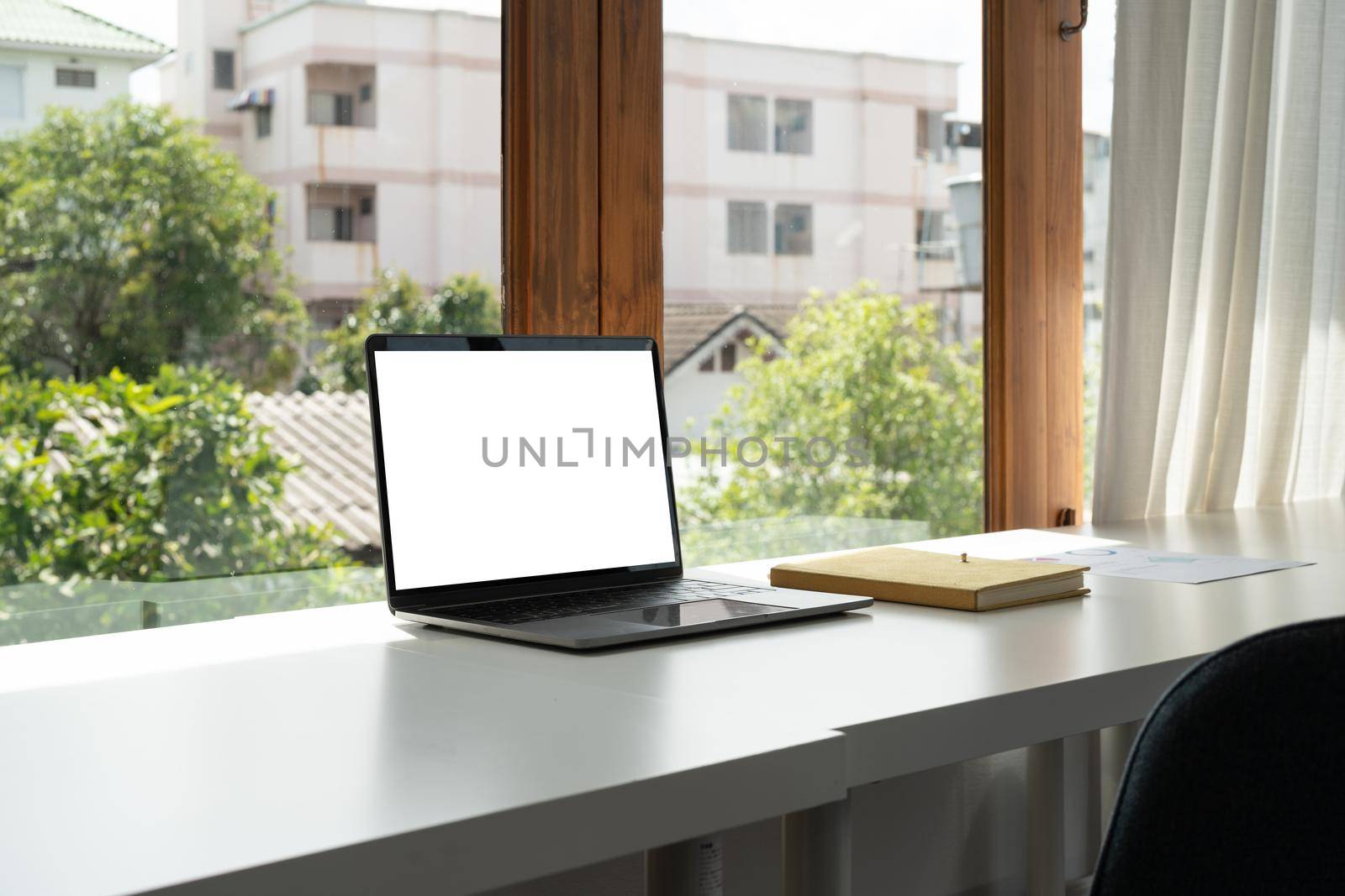 Blank screen computer laptop on working desk