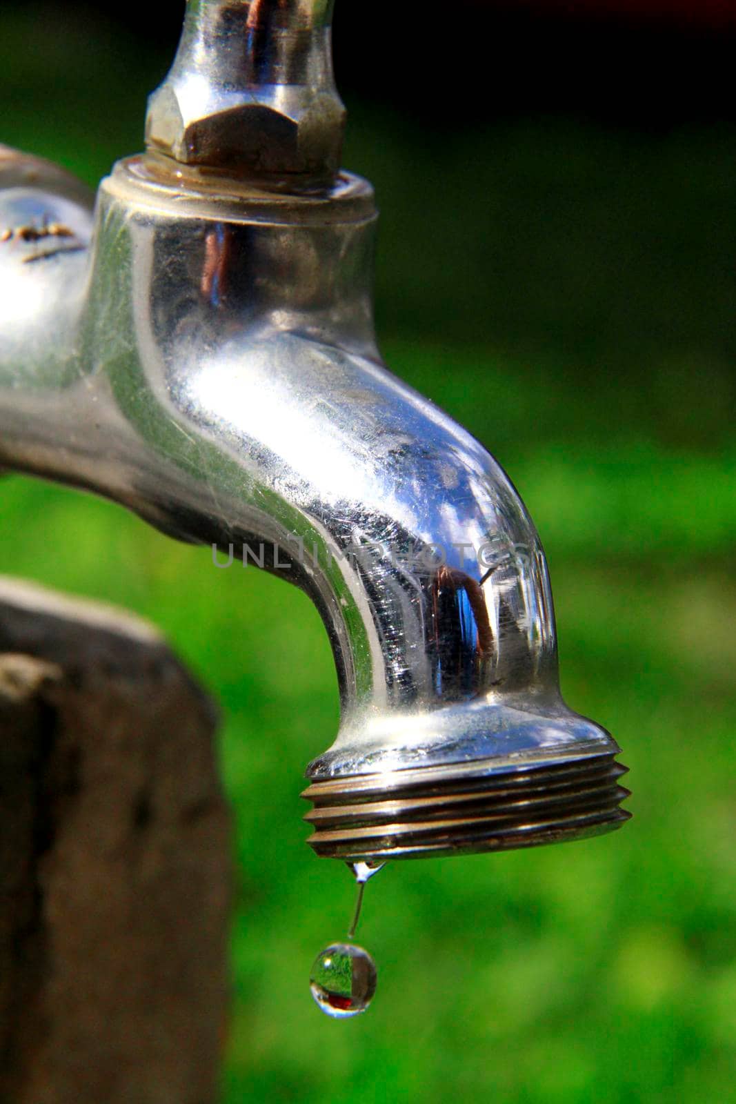 salvador, bahia / brazil - november 9, 2013: faucet is seen spouting water in a residence in the city of Salvador.