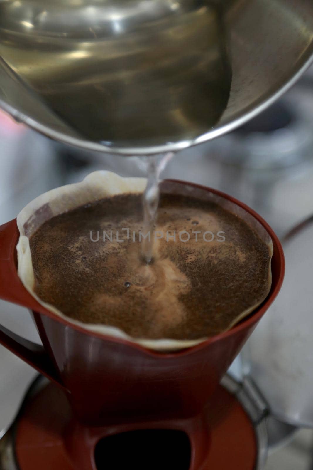 salvador, bahia / brazil - jJanuary 17, 2015: Coffee straining on filter paper in residence in Salvador city.
