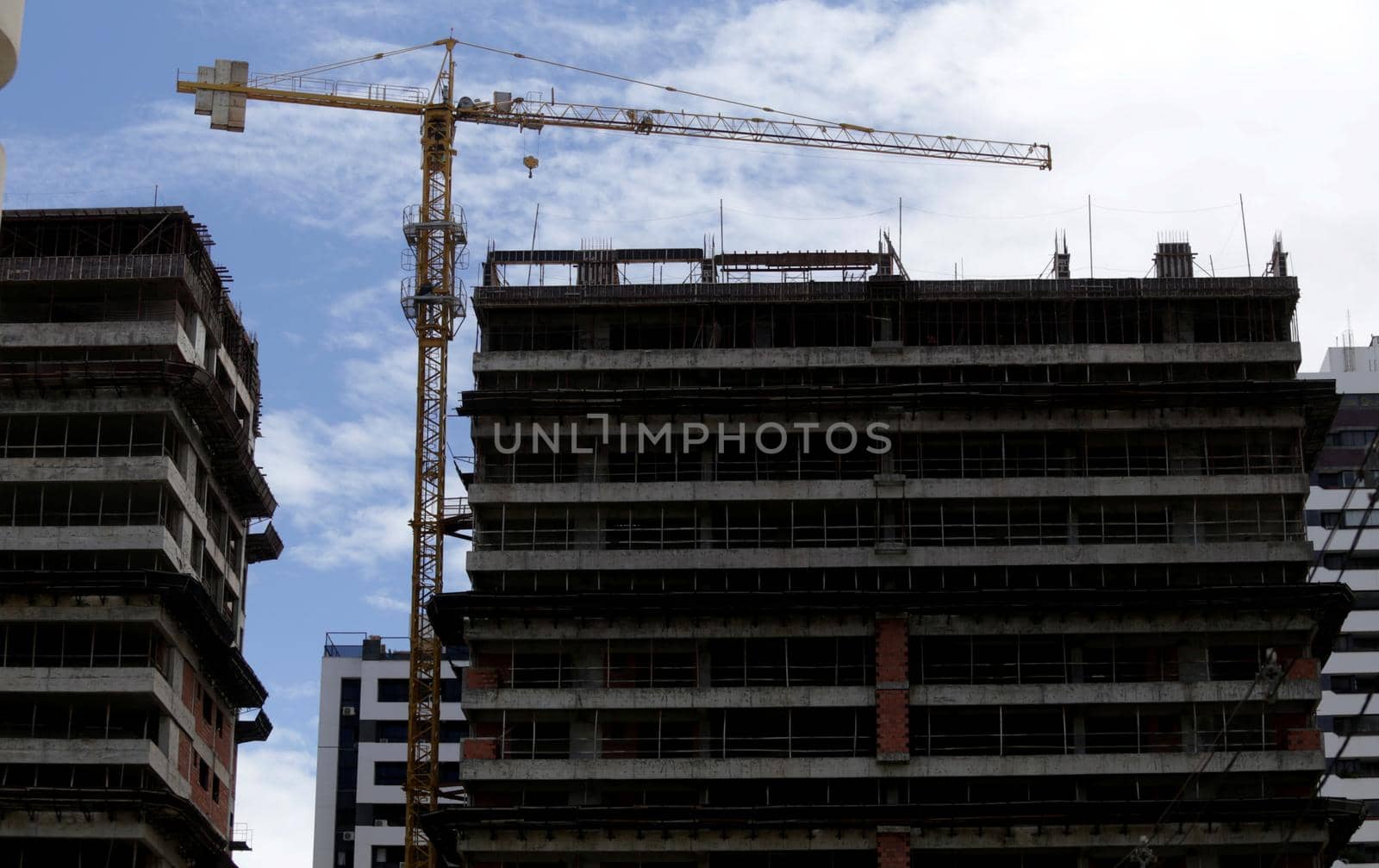 salvador, bahia / brazil - november 8, 2018: Crane is seen under construction of residential building in the neighborhood of Pituba in the city of Salvador.
