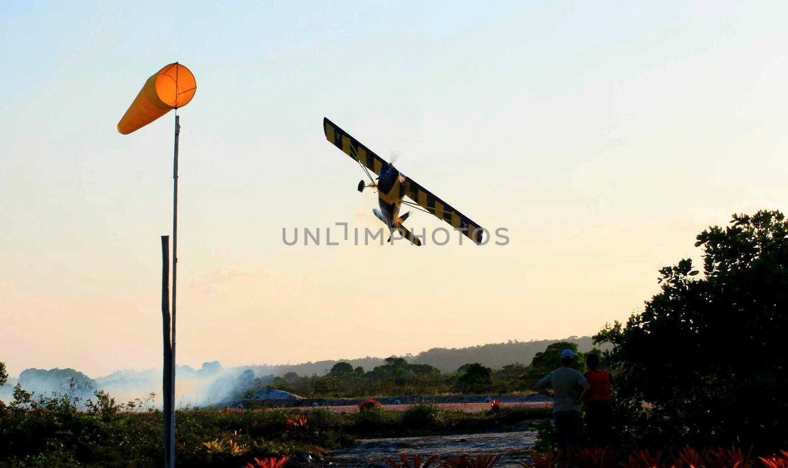 porto seguro, bahia / brazil - october 25, 2008: Small aircraft is seen during maneuvers at an air show with experimental aircraft in the city of Porto Seguro.

 