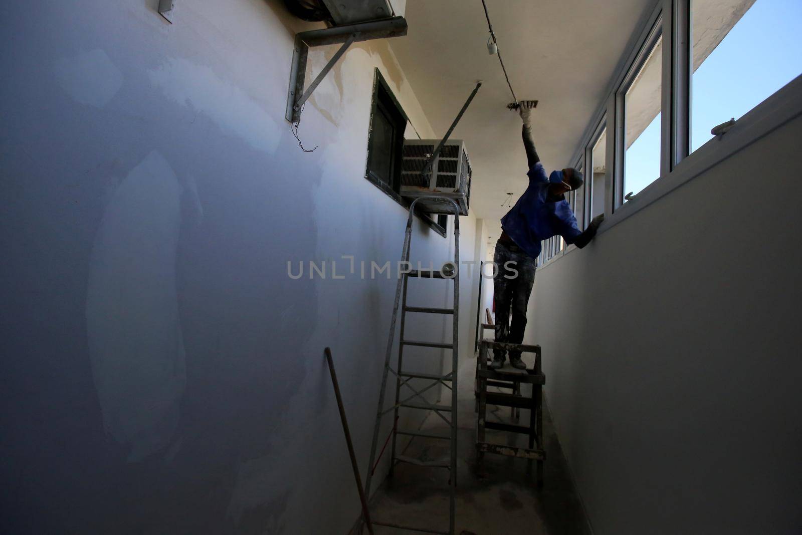 salvador, bahia / brazil - august 8, 2018: Wall painter is seen working at home in the city of Salvador.
