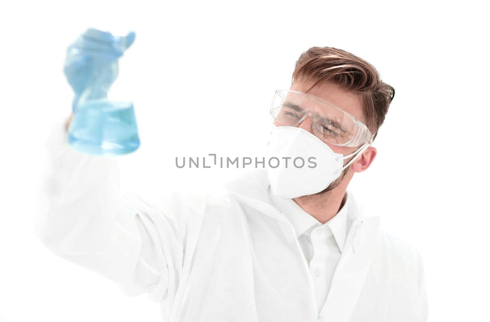 modern scientist examining the liquid in the flask.photo with copy space