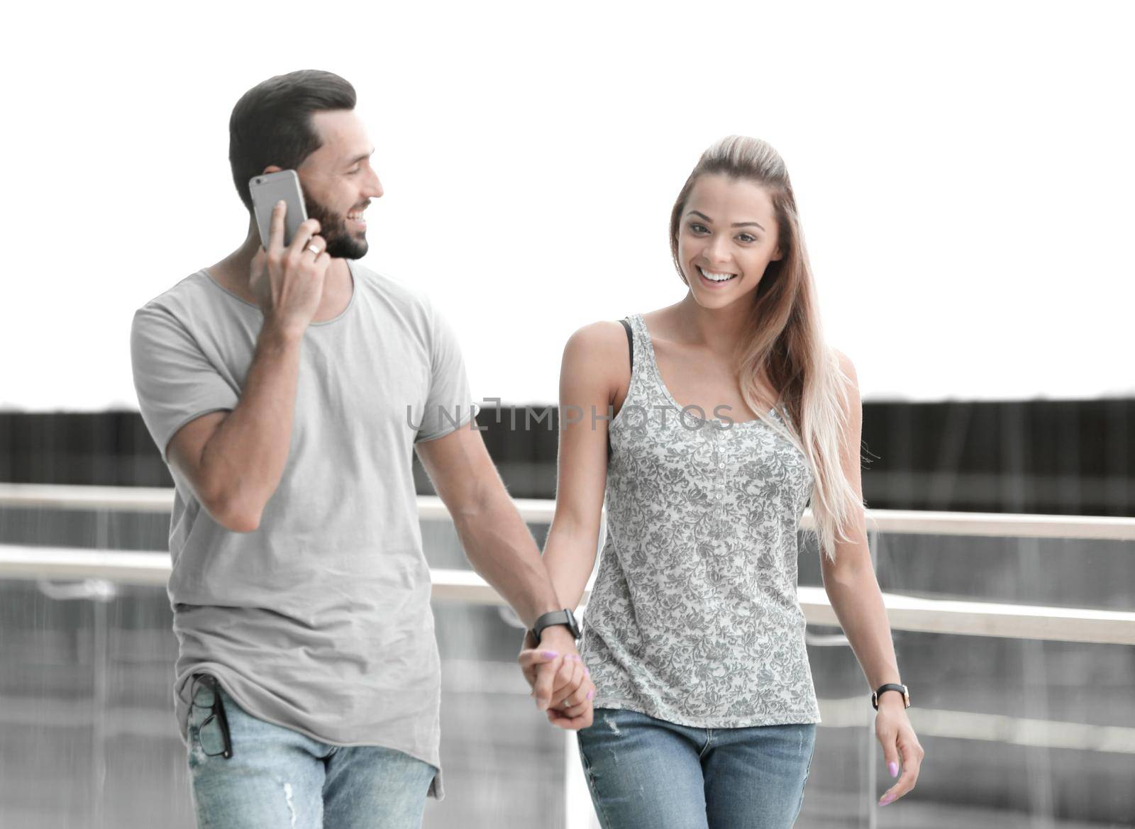 couple is walking through the lobby of a modern building.photo with copy space