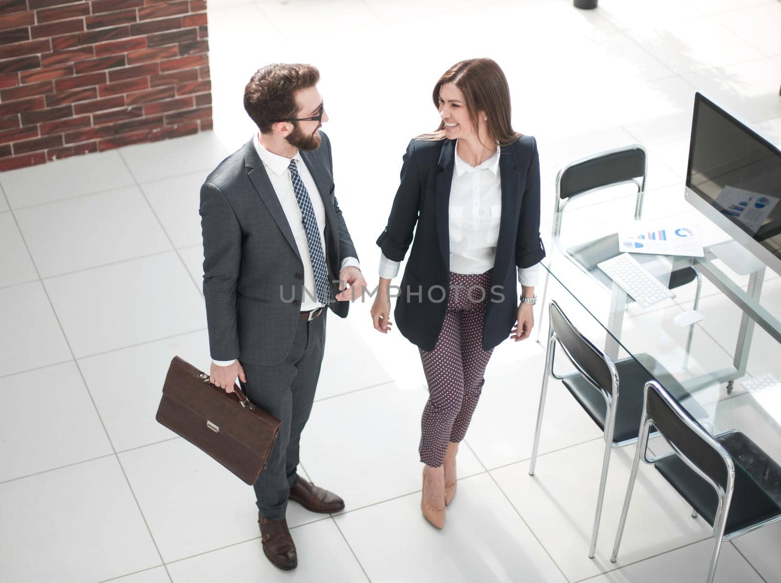 top view.business couple standing near the desktop . photo with copy space