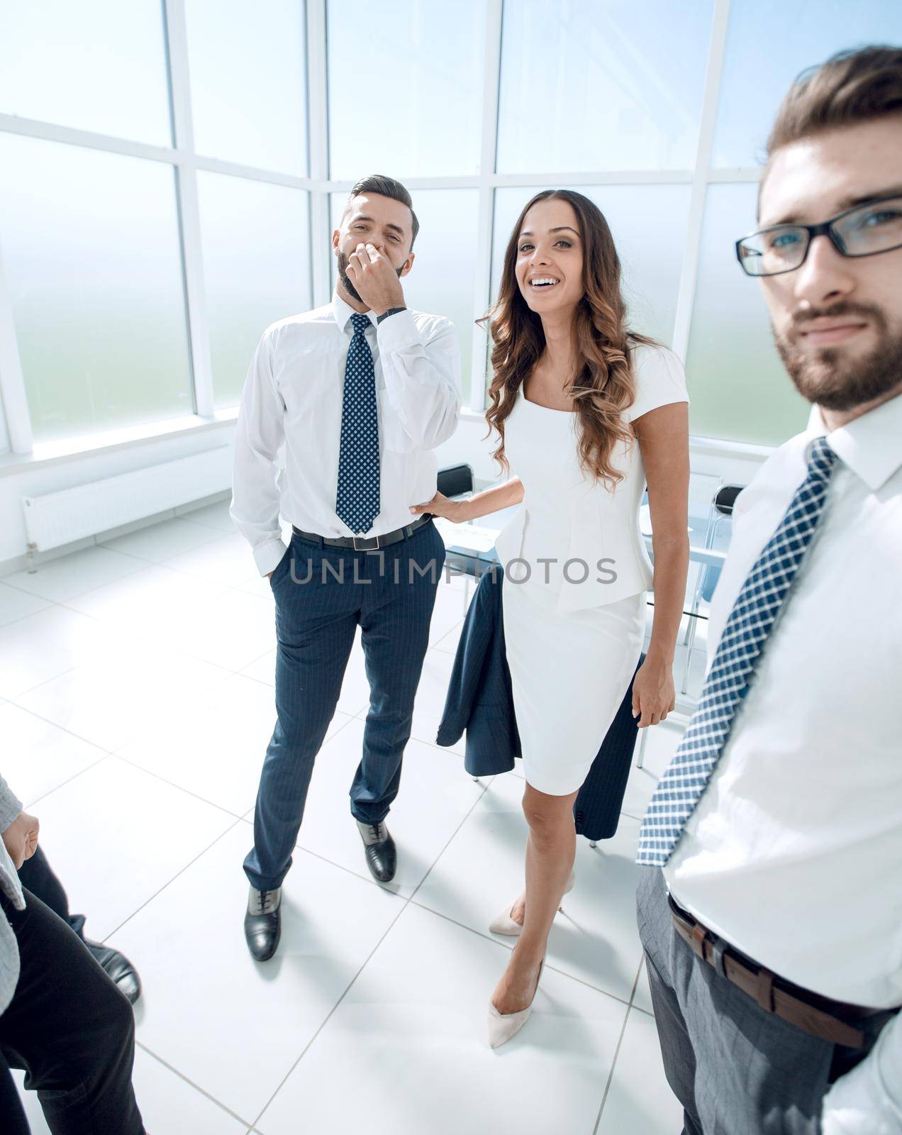 group of business people standing in the office lobby. photo with copy space