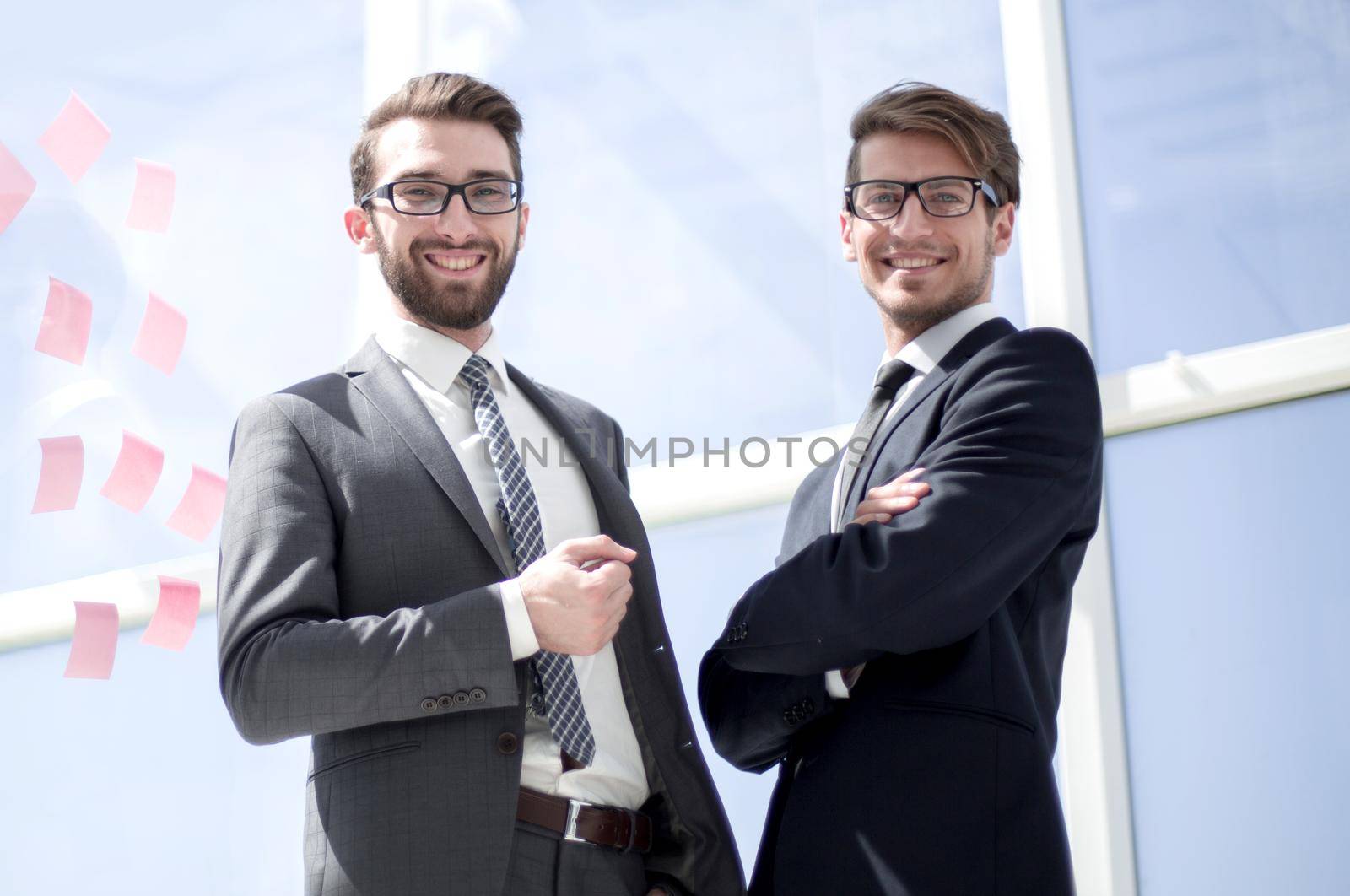 two successful business people standing in the office.business concept