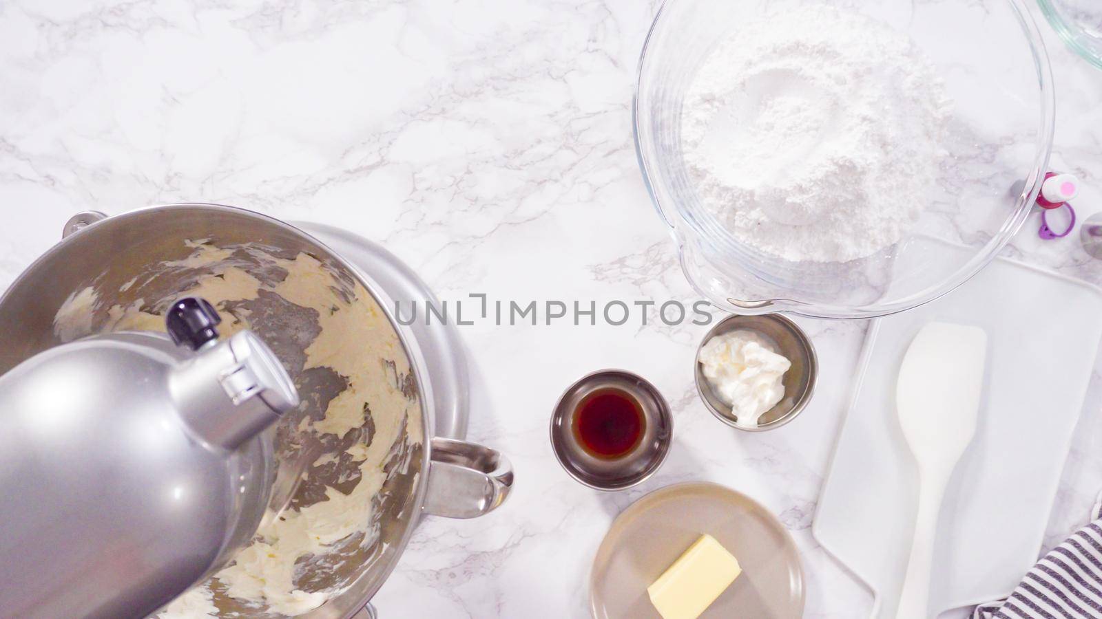 Flat lay. Step by step. Mixing ingredients in a standing kitchen mixer to prepare cream cheese frosting.