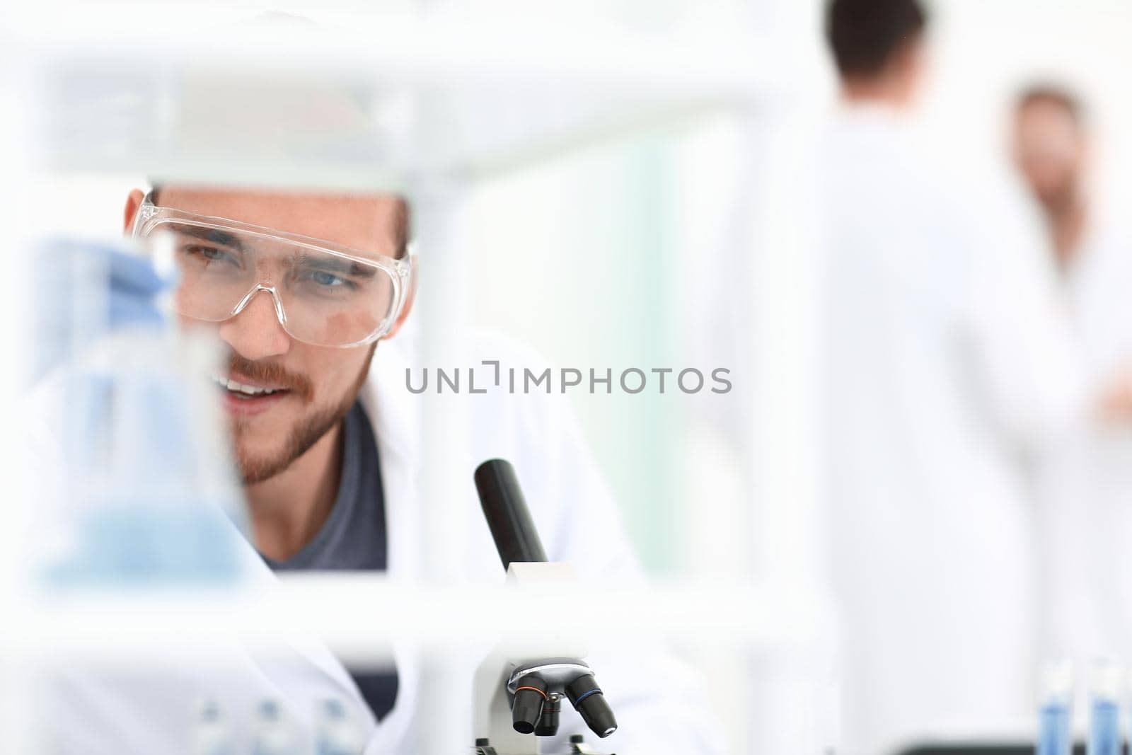 closeup.male chemist on blurred background laboratory .people and science.