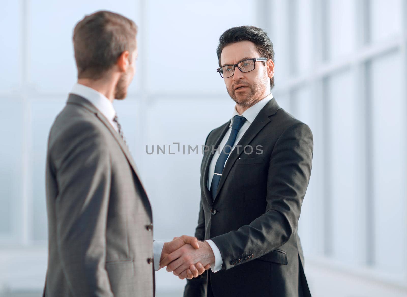 friendly handshake of business partners .the concept of cooperation