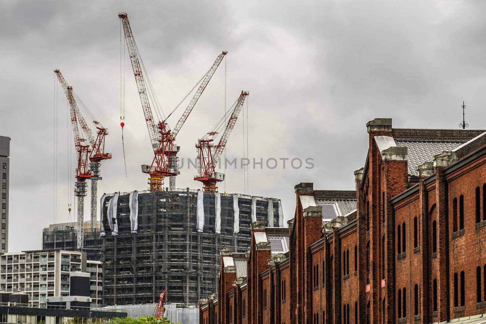 Mansion and red brick warehouse under construction. Shooting Location: Yokohama-city kanagawa prefecture