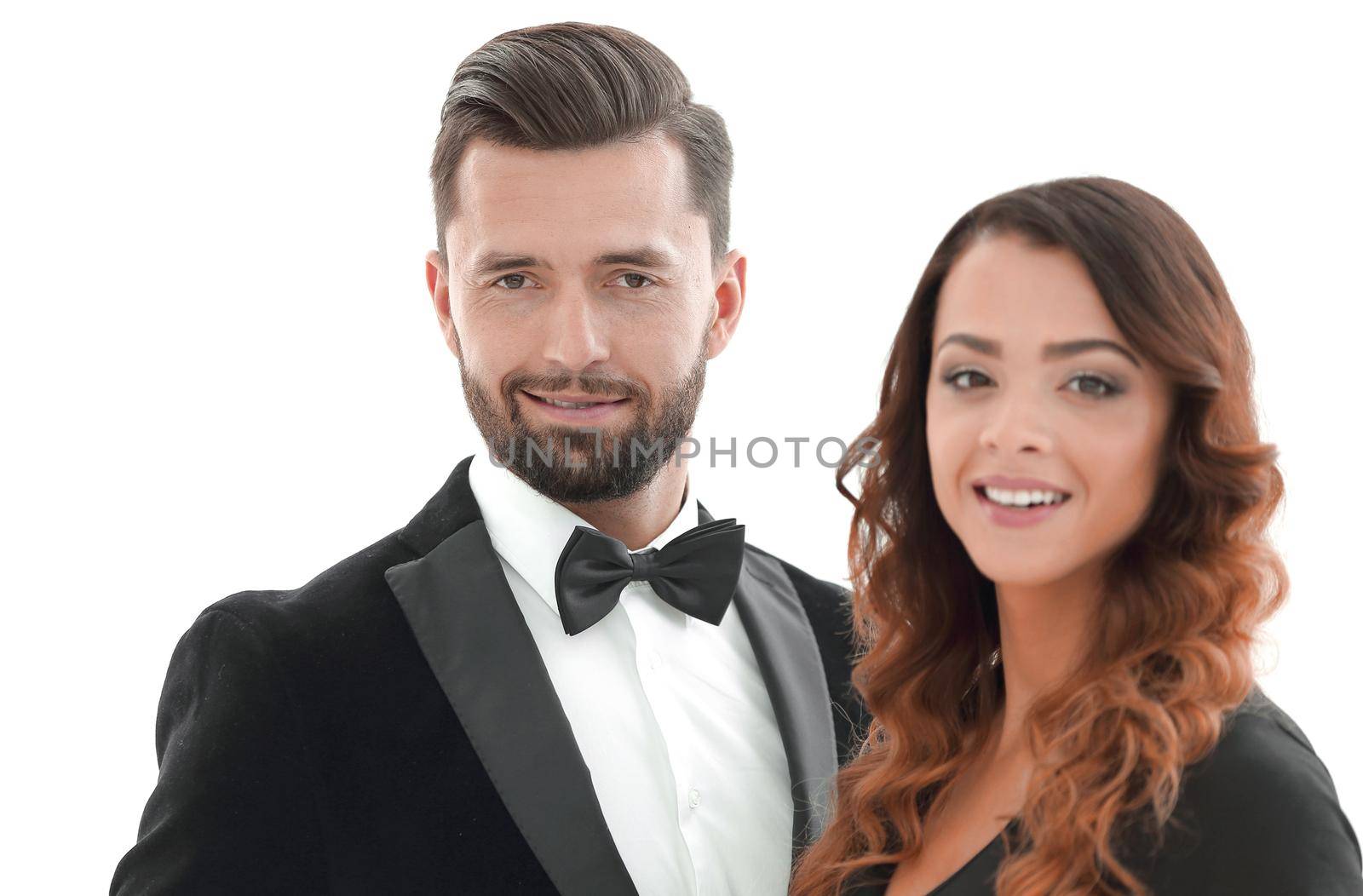 Portrait of a beautiful young man and woman dressed in classic clothes, studio shot over white background