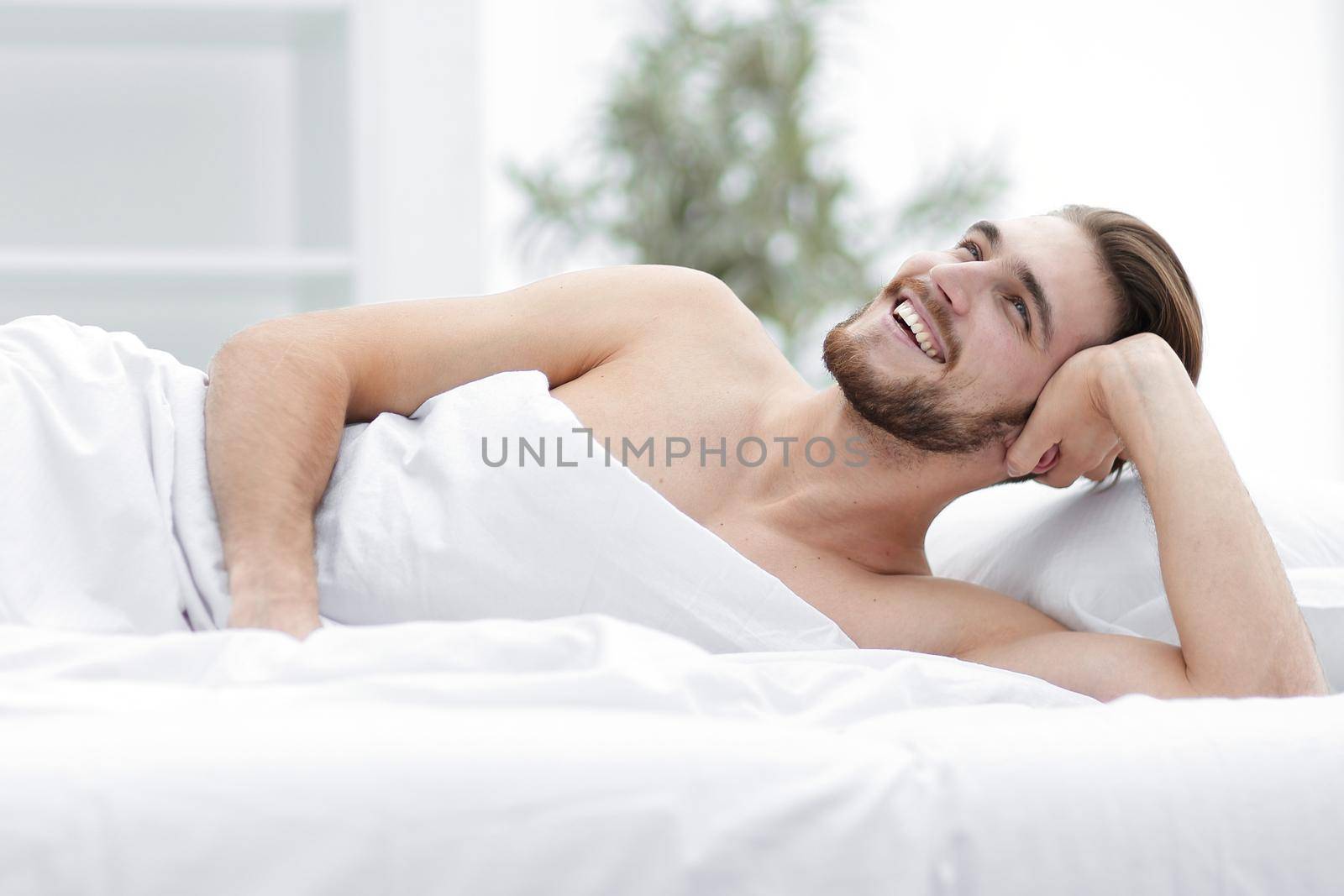 background image of a successful man wakes up in a new house