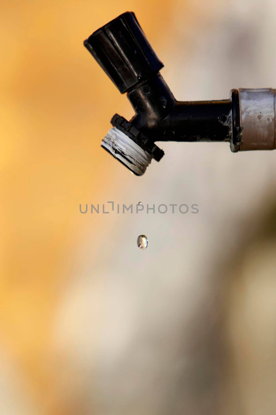 itajuipe, bahia, brazil - june 1, 2022: dripping garden faucet symbolizing lack of water.