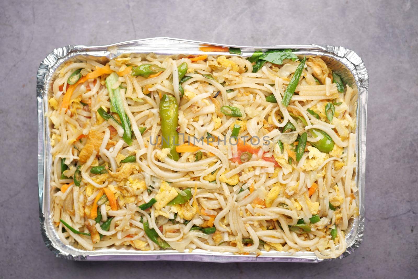 Curly Noodles in a take away packet top view
