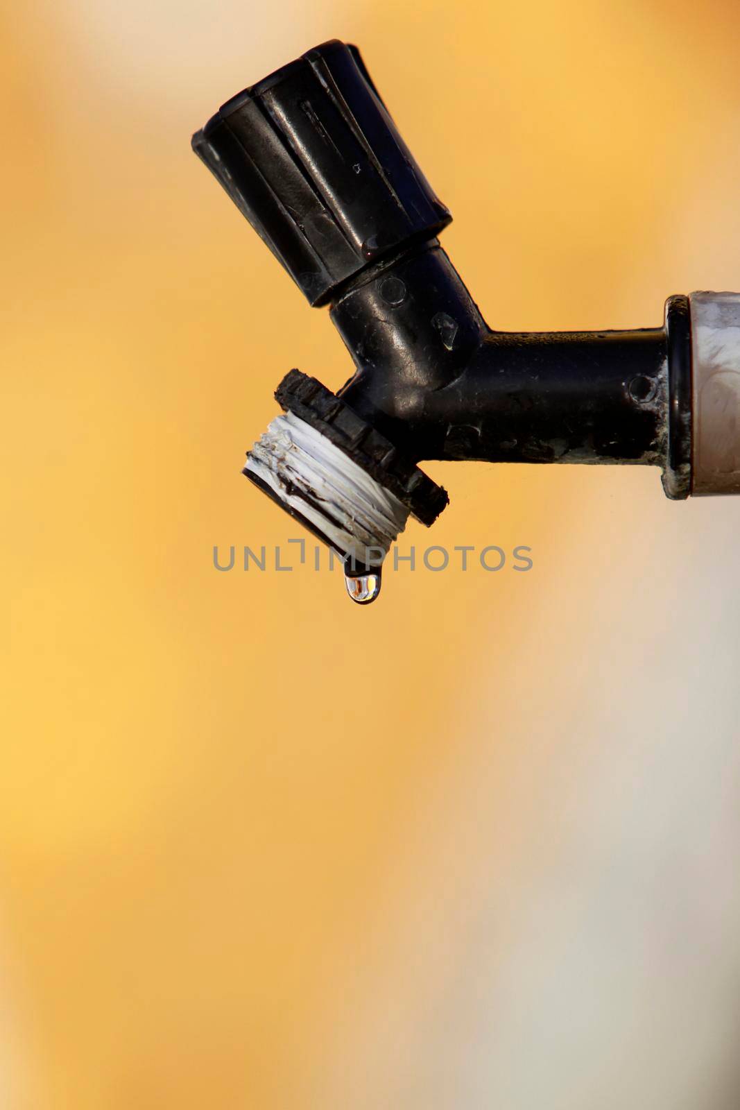 itajuipe, bahia, brazil - june 1, 2022: dripping garden faucet symbolizing lack of water.